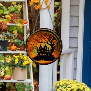 Detail of Halloween window hanger featuring a haunted house silhouette and chain