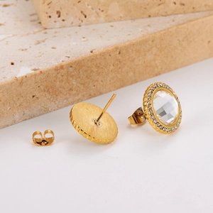 Detailed view of gold stainless steel stud earrings with round crystal halo and metal back
