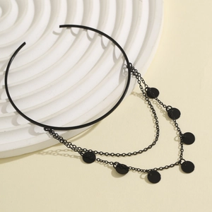 Gothic black choker featuring double chains and metallic disc accents on ripple background