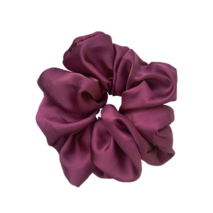 Elegant oversized mulberry purple satin scrunchie with smooth silk texture for hair