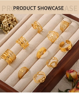 Detailed showcase of 10 gold woven and cutout adjustable rings in a beige velvet box