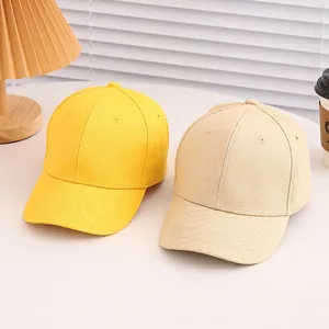Classic cotton baseball caps for kids in yellow and beige colors with curved brims