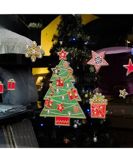 Detailed close-up of Christmas static window stickers featuring trees and snowflakes