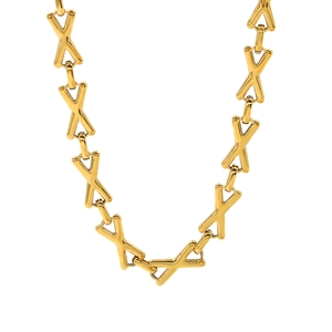 Macro detail of golden X-shaped interlocking links on a titanium steel necklace chain