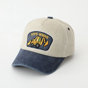 Detail view of the high-quality excavator embroidery and stitching on the kid's baseball cap