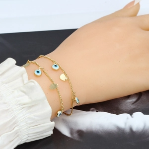 Bracciale dorato a doppio strato malocchio con ciondoli blu e pendente a forma di hamsa