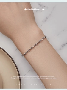 Close-up of minimalist S925 sterling silver chain bracelet with 3mm H-link design on wrist
