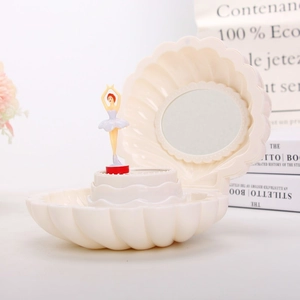 Detail of shell music box with dancing ballerina, round mirror, and cream white finish