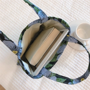Interior view showing the large capacity of the floral tote bag for tablets and books