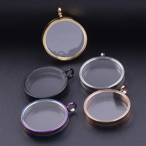 Detail of round stainless steel glass lockets in gold, silver, rose gold and black colors