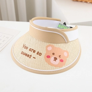 Close-up of kids straw sun visor with cartoon bear embroidery and adjustable green strap