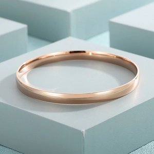 Detailed macro shot of rose gold titanium steel bracelet with polished mirror surface