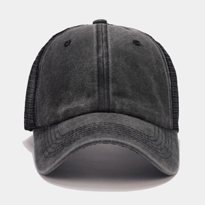 Detailed close-up of breathable mesh back and washed vintage canvas on baseball cap