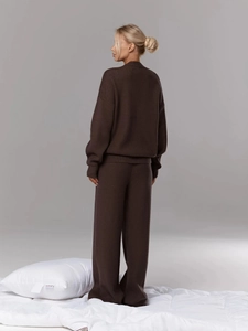 Rear view of brown two-piece knit set featuring sweater and high-waist wide-leg pants
