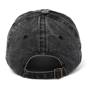 Close-up of vintage washed baseball cap back showing metal adjustment buckle and texture