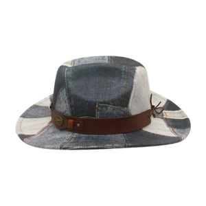 Detail of western cowboy hat with patchwork denim fabric and brown leather decorative band