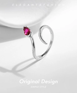 Macro shot of S925 sterling silver ring showing the inner stamp and red teardrop gem