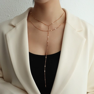 Double-layered 18k rose gold titanium steel Y-shaped tassel necklace on model