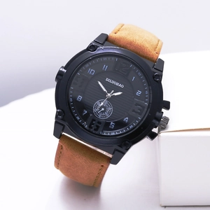 Close-up of men's quartz watch with black dial and brown vintage leather strap