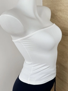 Side view of white elastic bandeau top showing slim fit and premium stretch fabric
