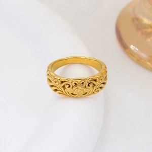 Vintage 18K gold plated stainless steel ring featuring intricate floral carvings and geometry