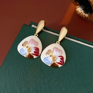Vintage style floral enamel drop earrings with gold finish and colorful petal patterns