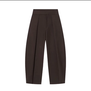 Detailed view of dark brown high-waisted wide-leg trousers with front pleats and refined seams