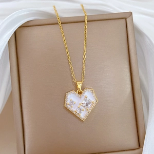 Elegant gold titanium steel necklace with a white zircon heart pendant in a gift box