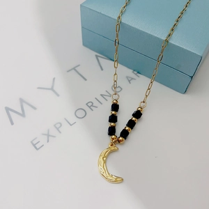 French retro style 18k gold moon pendant necklace with black beads and textured finish