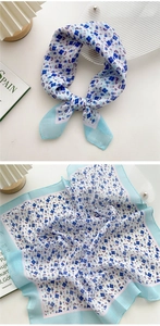 Detail of blue and white floral cotton-linen scarf showing fabric texture and patterns