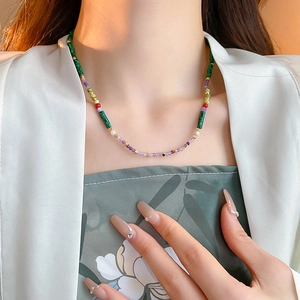 Detailed shot of multi-color beaded necklace with freshwater pearls and gold plating