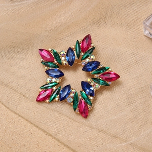 Elegant gold five-point star brooch with colorful rhinestones and hollow design