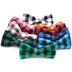 Close-up of assorted plaid pet bowties in various colors on a clean white background