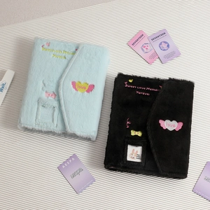 Detail of blue and black plush photocard albums with Sweet Love Memory embroidery
