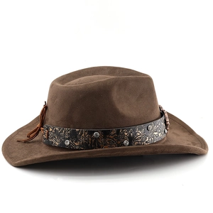 Detail of brown felt cowboy hat featuring leather band with paisley patterns and silver studs