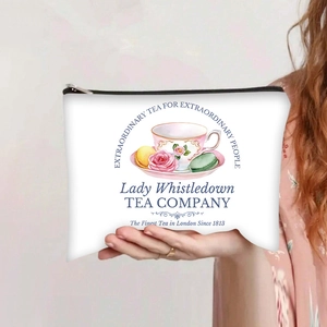 Detail of the vintage floral tea party pattern on a canvas cosmetic bag with black zipper