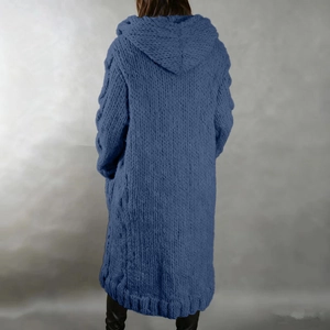 Detail view of the chunky knit texture and hood on a long blue cardigan sweater