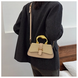 Detail view of khaki striped flap bag with iconic gold H clasp and metal handle