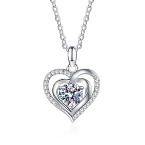 925 sterling silver heart necklace with round moissanite pendant on white mirror background