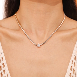 Vintage 18k gold plated stainless steel star pendant necklace with zircons on a model