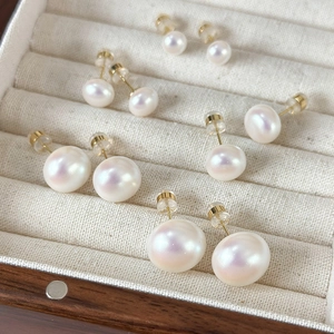 Elegant white pearl stud earrings set in various sizes from 5mm to 10mm in a jewelry box