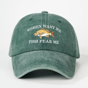 Close-up of Fish Fear Me embroidery on vintage washed green cotton baseball cap