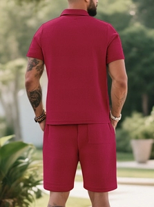 Rear view of men's red short sleeve set with distinctive waffle texture polo and shorts