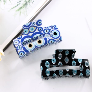 Vintage style eye pattern rectangular hair claw clips in blue and black acetate finish