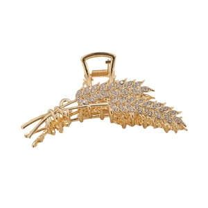 Elegant gold metal wheat ear hair claw clip with sparkling rhinestones on white background
