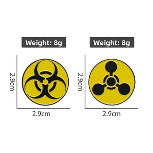 Detail view of 2.9cm enamel pins showing biohazard and radioactive signs with 8g weight
