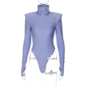 Detail view of purple bodysuit featuring padded shoulders and unique thumbhole sleeves