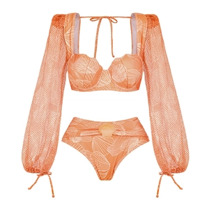 Detail of orange bikini set with mesh long sleeves and white seashell patterns