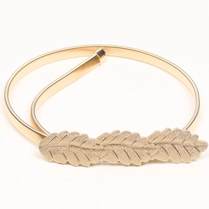 Detailed view of elastic gold metal spring belt with three engraved leaves decoration