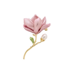 Elegant magnolia flower brooch with pink gradient petals and pearl on a golden stem
